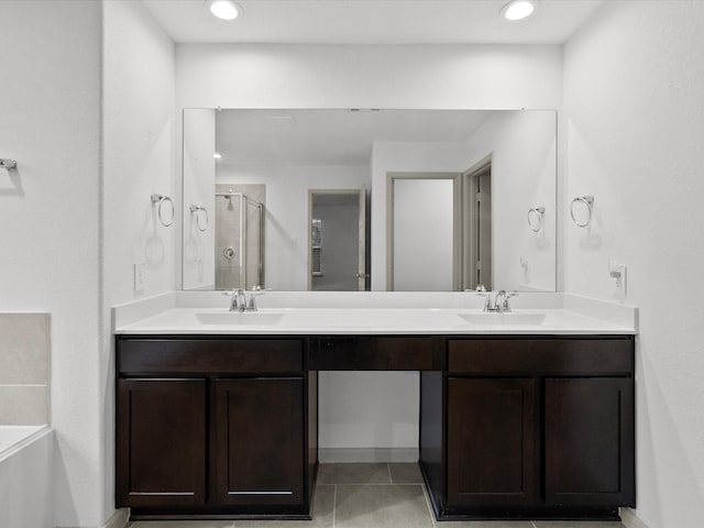 bathroom featuring tile patterned floors, vanity, and plus walk in shower