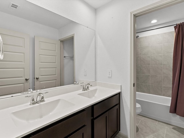 full bathroom featuring shower / bath combination with curtain, tile patterned floors, vanity, and toilet