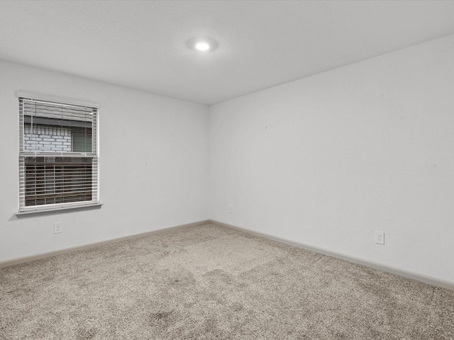 unfurnished room featuring carpet floors