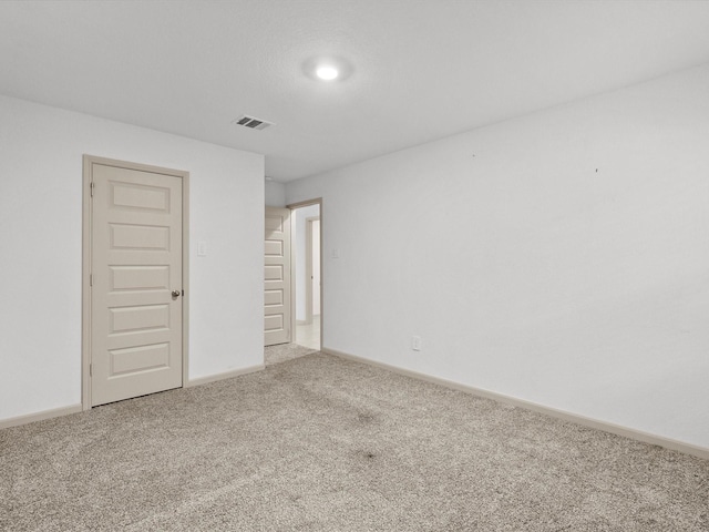 spare room with carpet floors