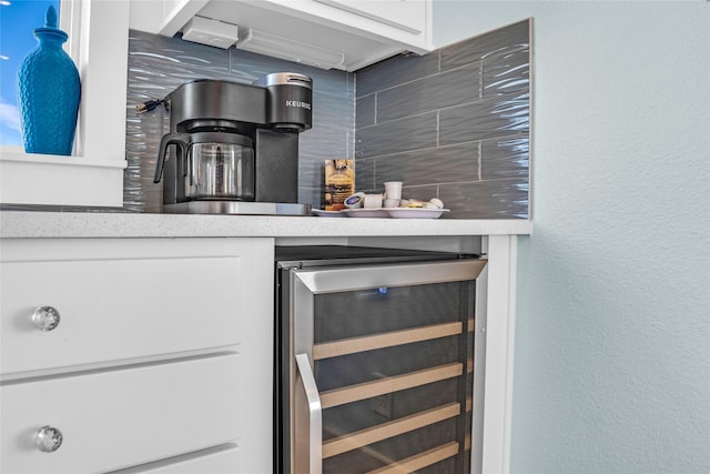 kitchen with white cabinetry and wine cooler