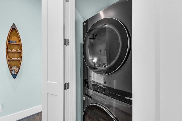 laundry area featuring stacked washer and dryer