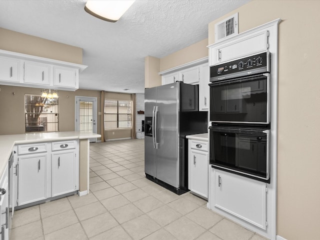 kitchen with black double oven, stainless steel refrigerator with ice dispenser, a textured ceiling, white cabinets, and kitchen peninsula