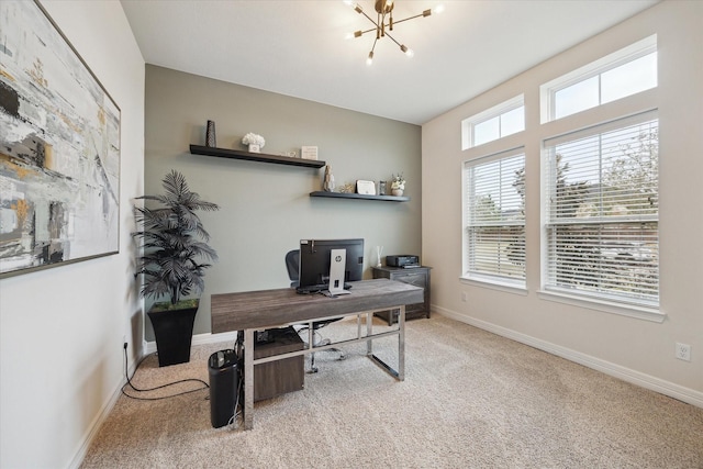 office area featuring carpet and a notable chandelier