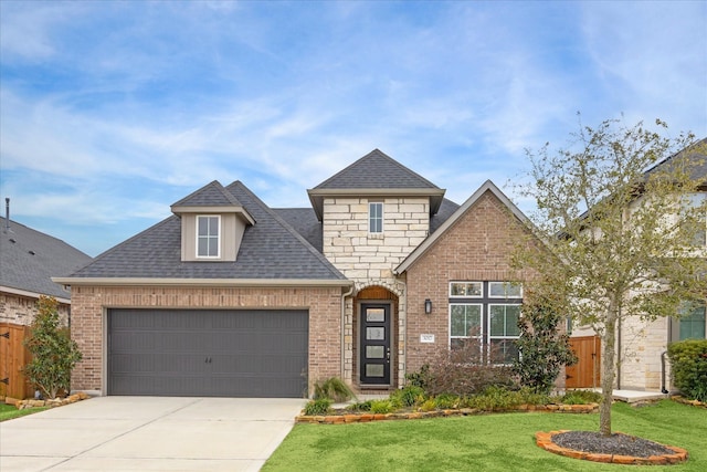 view of front of home featuring a garage and a front yard