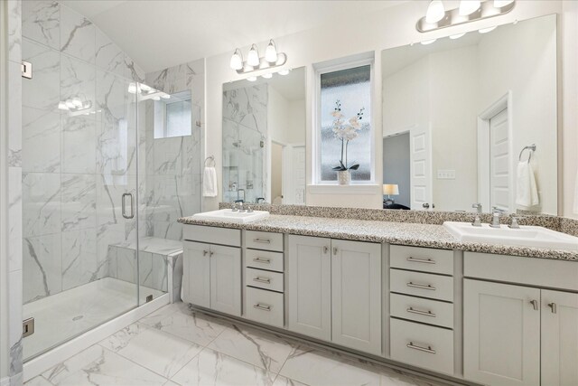 bathroom featuring vanity, an enclosed shower, and vaulted ceiling