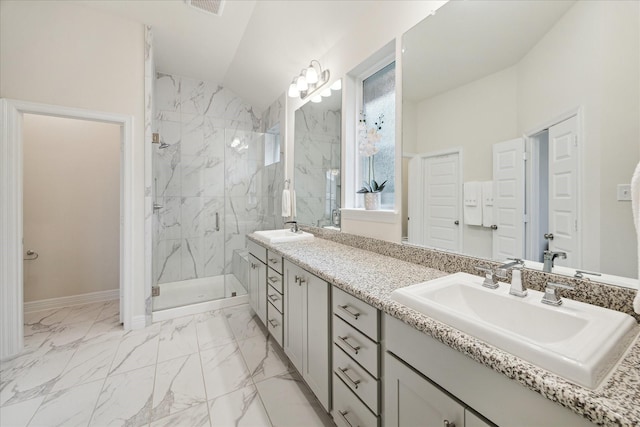 bathroom featuring lofted ceiling, a shower with door, and vanity