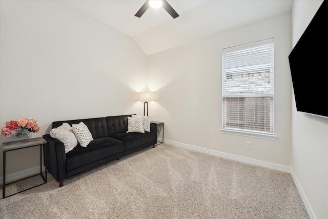 living room featuring carpet floors, vaulted ceiling, and ceiling fan