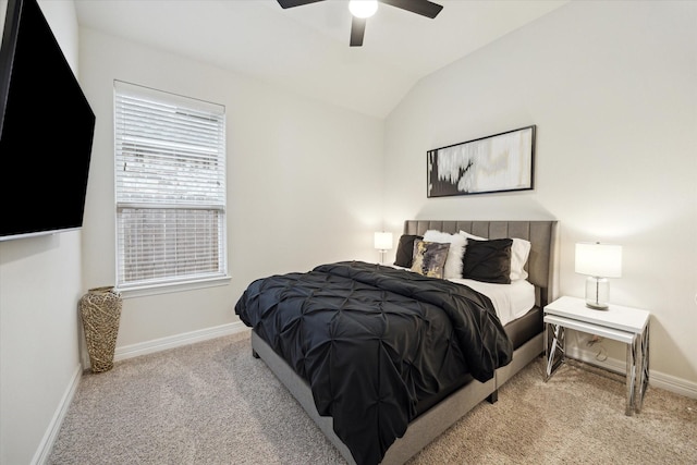 bedroom featuring ceiling fan, lofted ceiling, and light carpet