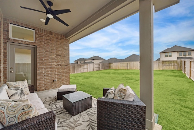 view of patio / terrace with ceiling fan and an outdoor living space