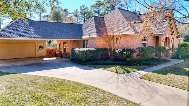 view of front of house with a garage and a front lawn