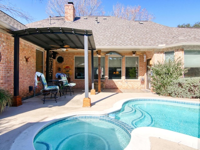 view of pool featuring ceiling fan and a patio area