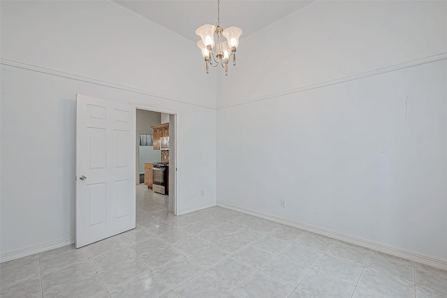 tiled empty room featuring high vaulted ceiling and a chandelier