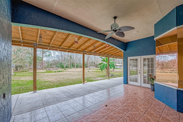 view of patio featuring ceiling fan and french doors