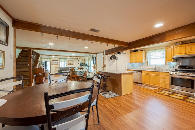 dining area featuring recessed lighting, visible vents, stairs, light wood-type flooring, and beamed ceiling