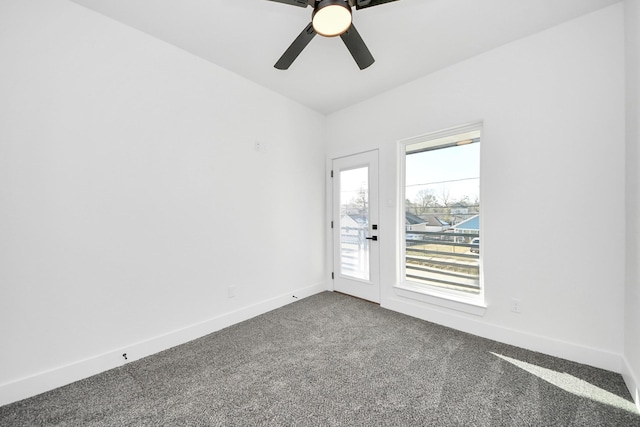 spare room with ceiling fan and carpet flooring