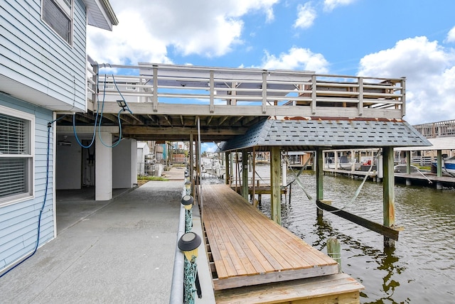 view of dock with a water view