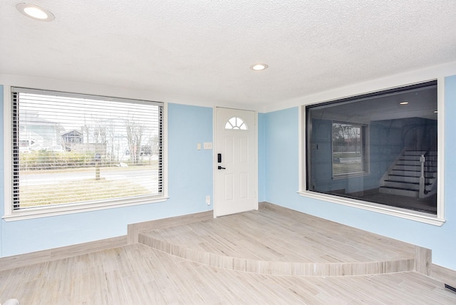 entrance foyer with a textured ceiling