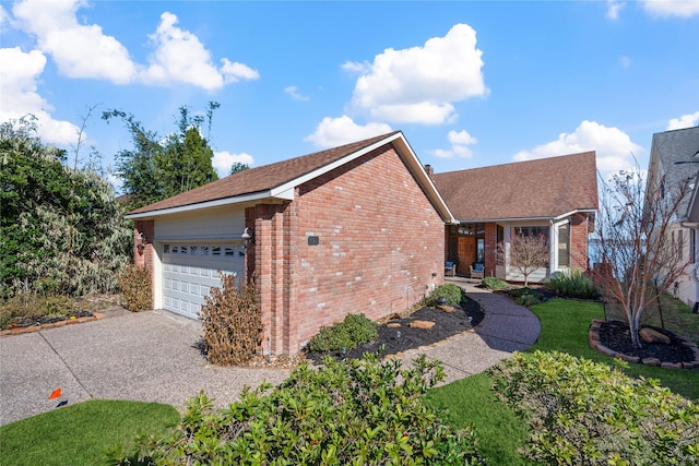 ranch-style home featuring a garage and a front yard