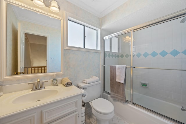 full bathroom featuring tile patterned floors, toilet, vanity, ornamental molding, and enclosed tub / shower combo