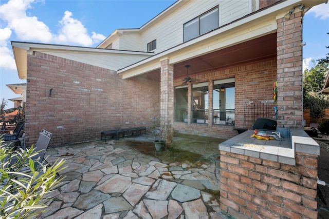 view of patio featuring ceiling fan