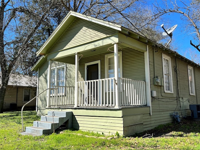 view of front of property with central AC and covered porch