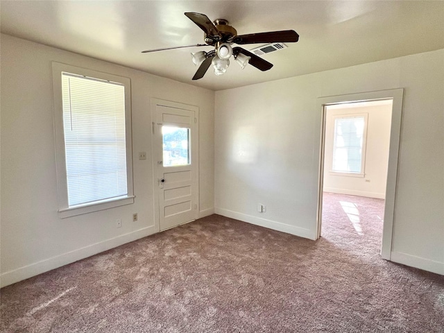 interior space with ceiling fan