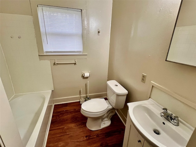 bathroom with vanity, wood-type flooring, and toilet