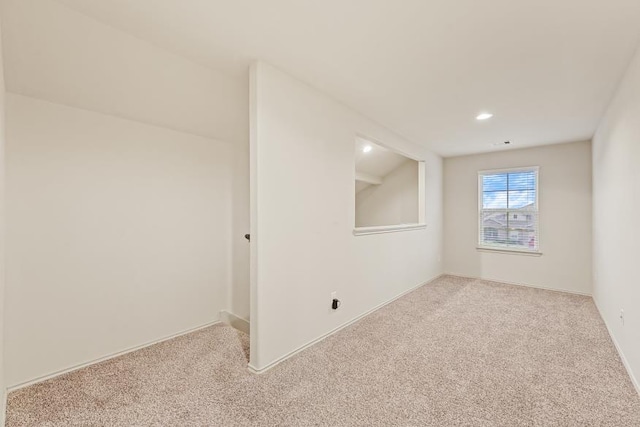 empty room with light colored carpet