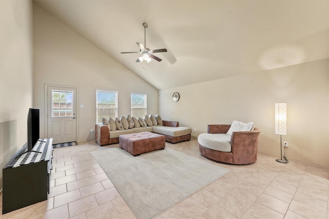 tiled living room with ceiling fan and high vaulted ceiling