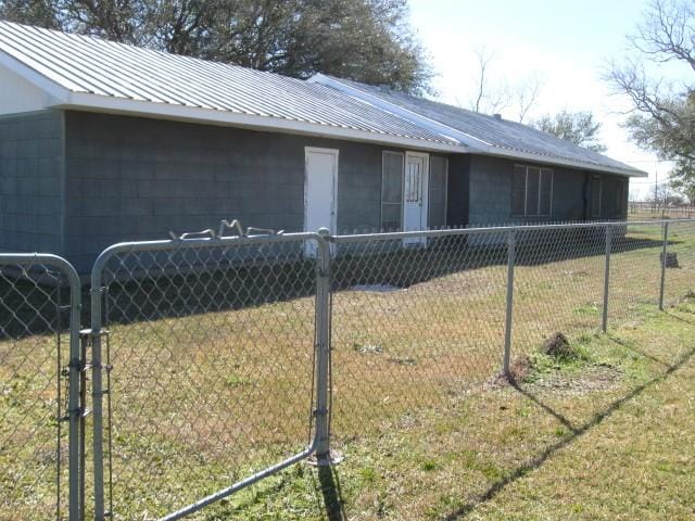 view of side of home featuring a yard