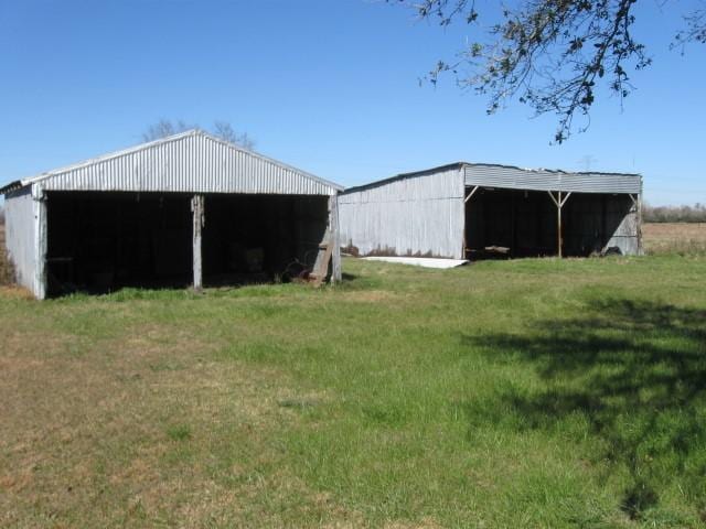 view of outbuilding with a yard