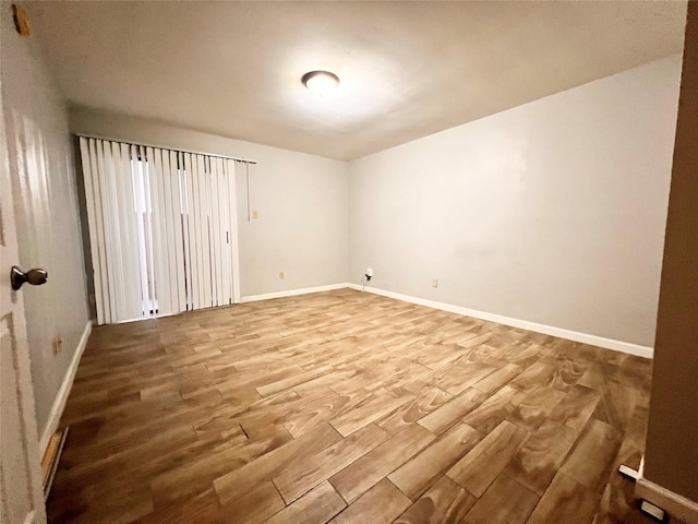 spare room featuring hardwood / wood-style floors