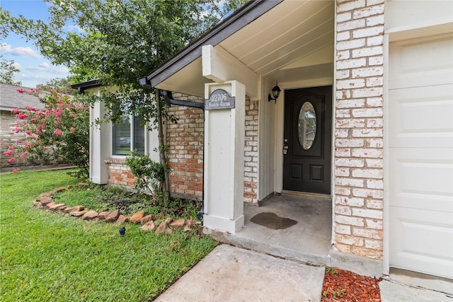 22706 Braken Carter Ln, Katy, TX 77449 - doorway to property featuring brick siding and a yard