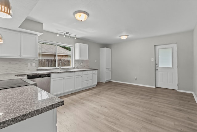 22706 Braken Carter Ln, Katy, TX 77449 - kitchen featuring dishwasher, decorative backsplash, white cabinetry, and light wood-type flooring