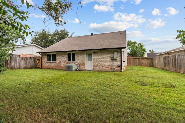 22706 Braken Carter Ln, Katy, TX 77449 - back of house featuring brick siding, a fenced backyard, and a shingled roof
