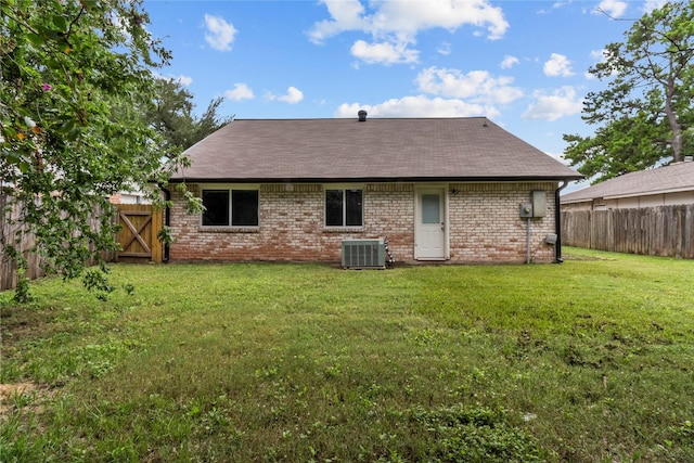 22706 Braken Carter Ln, Katy, TX 77449 - back of house with a fenced backyard, a shingled roof, and brick siding
