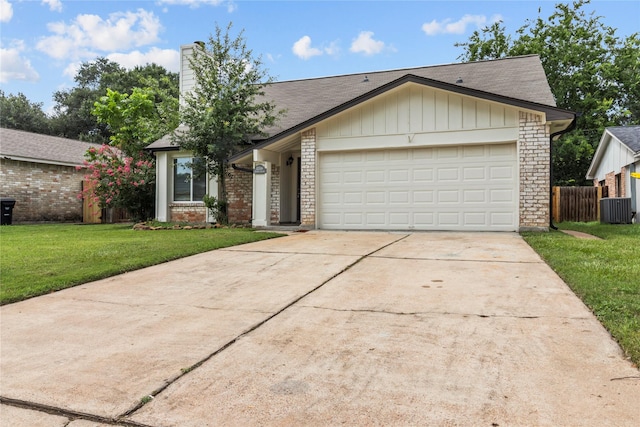22706 Braken Carter Ln, Katy, TX 77449 - view of front of house featuring driveway, a chimney, an attached garage, brick siding, and roof with shingles