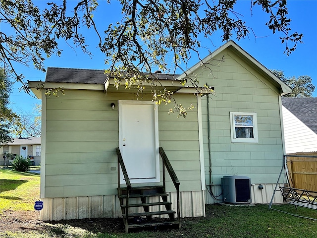 rear view of house with cooling unit