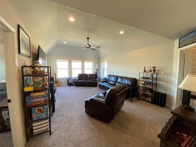 living room with vaulted ceiling, carpet, and ceiling fan