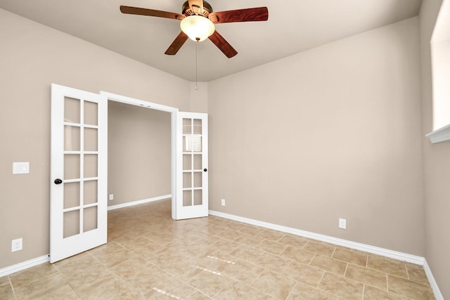 spare room featuring french doors and ceiling fan