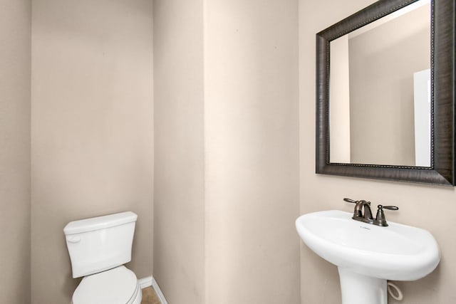 bathroom with toilet and sink