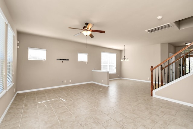 spare room featuring light tile patterned floors and ceiling fan