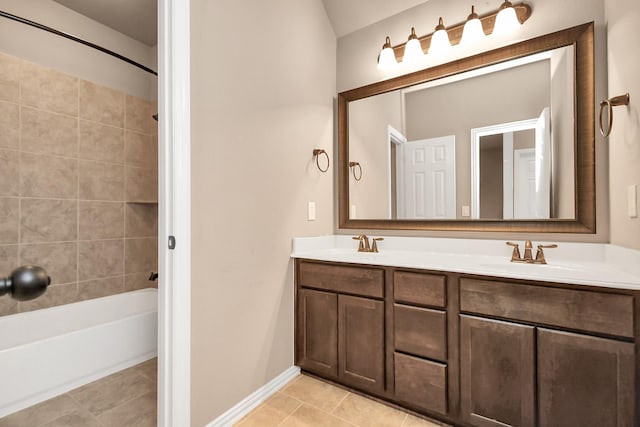 bathroom with vanity, tiled shower / bath combo, and tile patterned floors