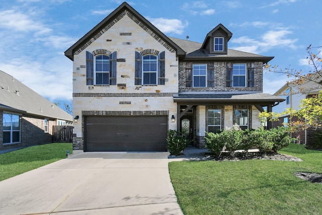 view of front of house featuring a garage and a front lawn