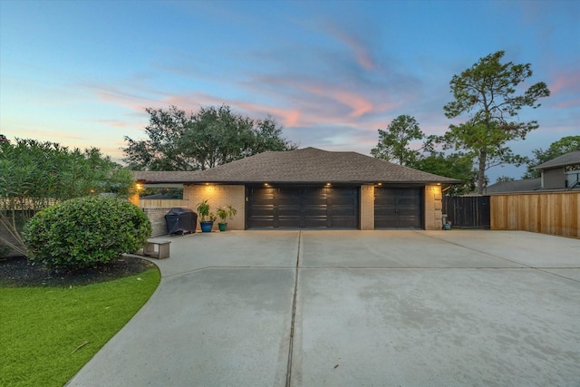 single story home featuring a garage