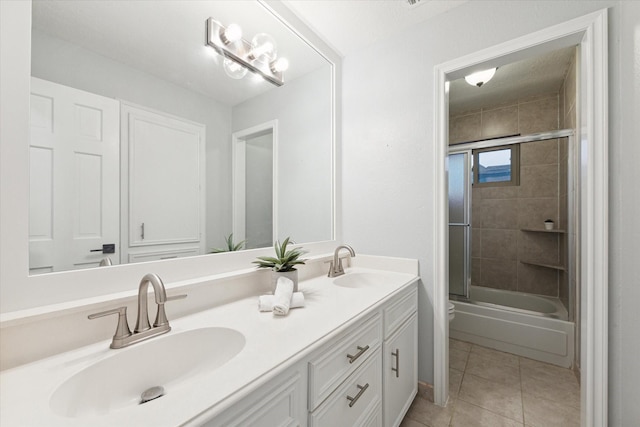 full bathroom featuring tile patterned flooring, enclosed tub / shower combo, vanity, and toilet