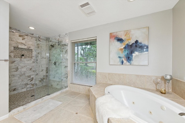 bathroom featuring tile patterned floors and shower with separate bathtub