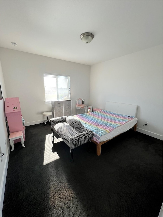 bedroom with dark colored carpet