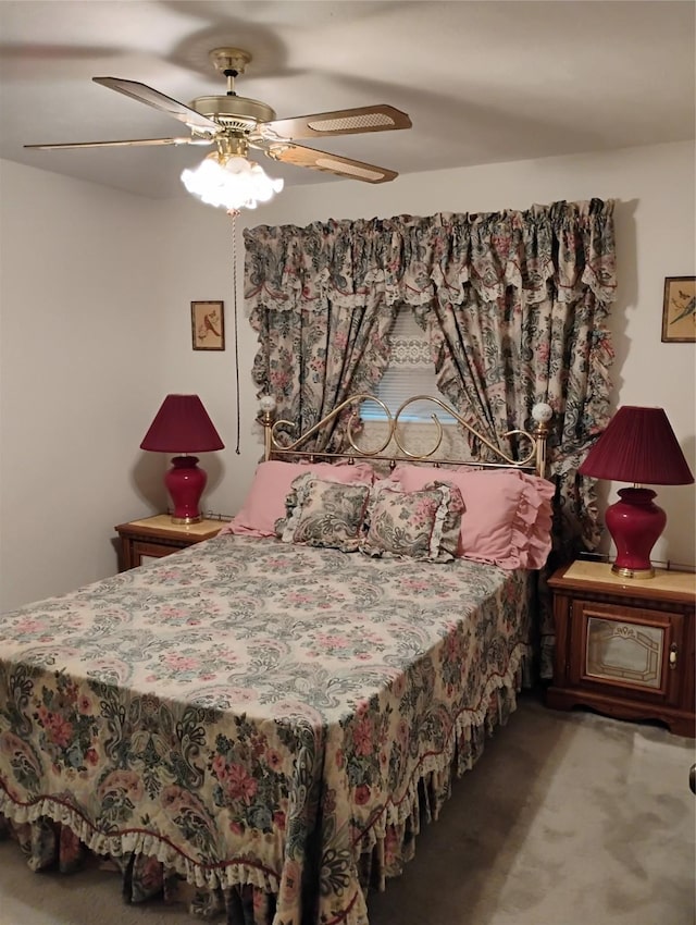 bedroom with ceiling fan and carpet flooring